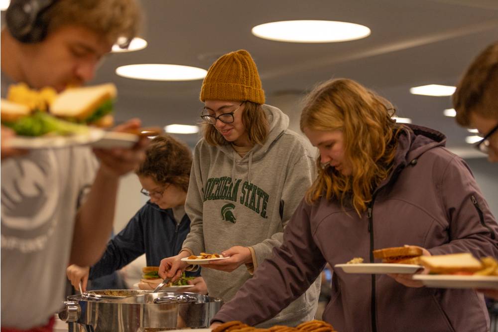 Students loading food onto their plates